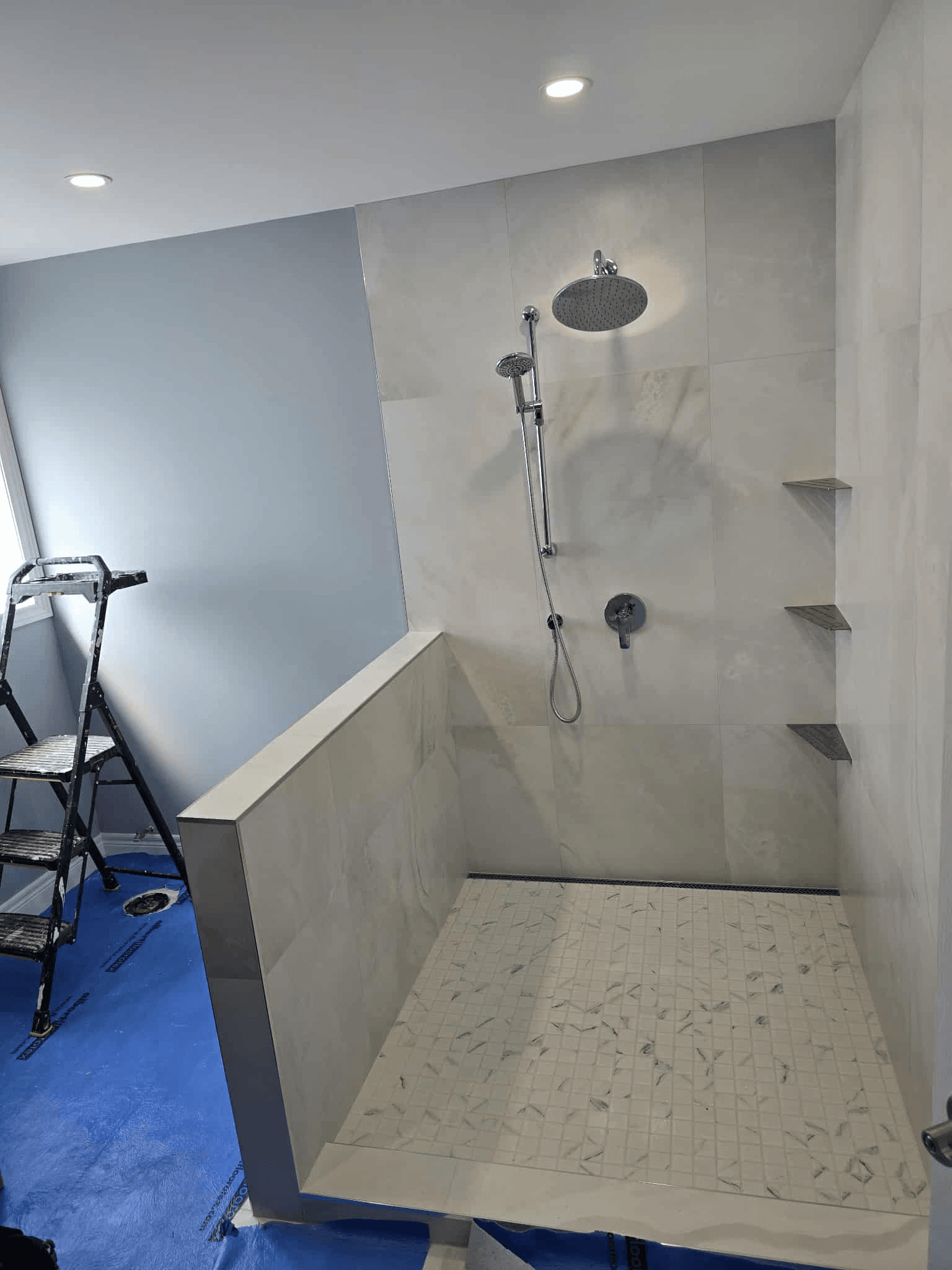 Glass shower with half wall