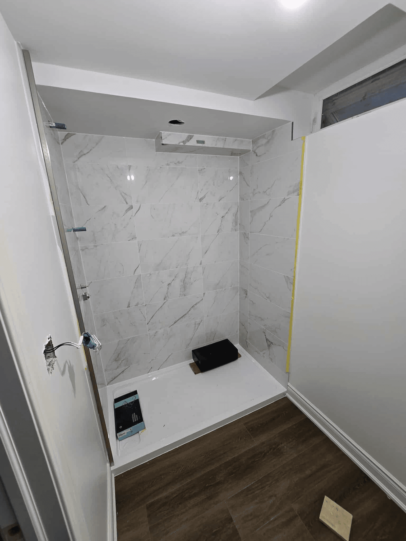 Walk-in shower with full-length glass doors
