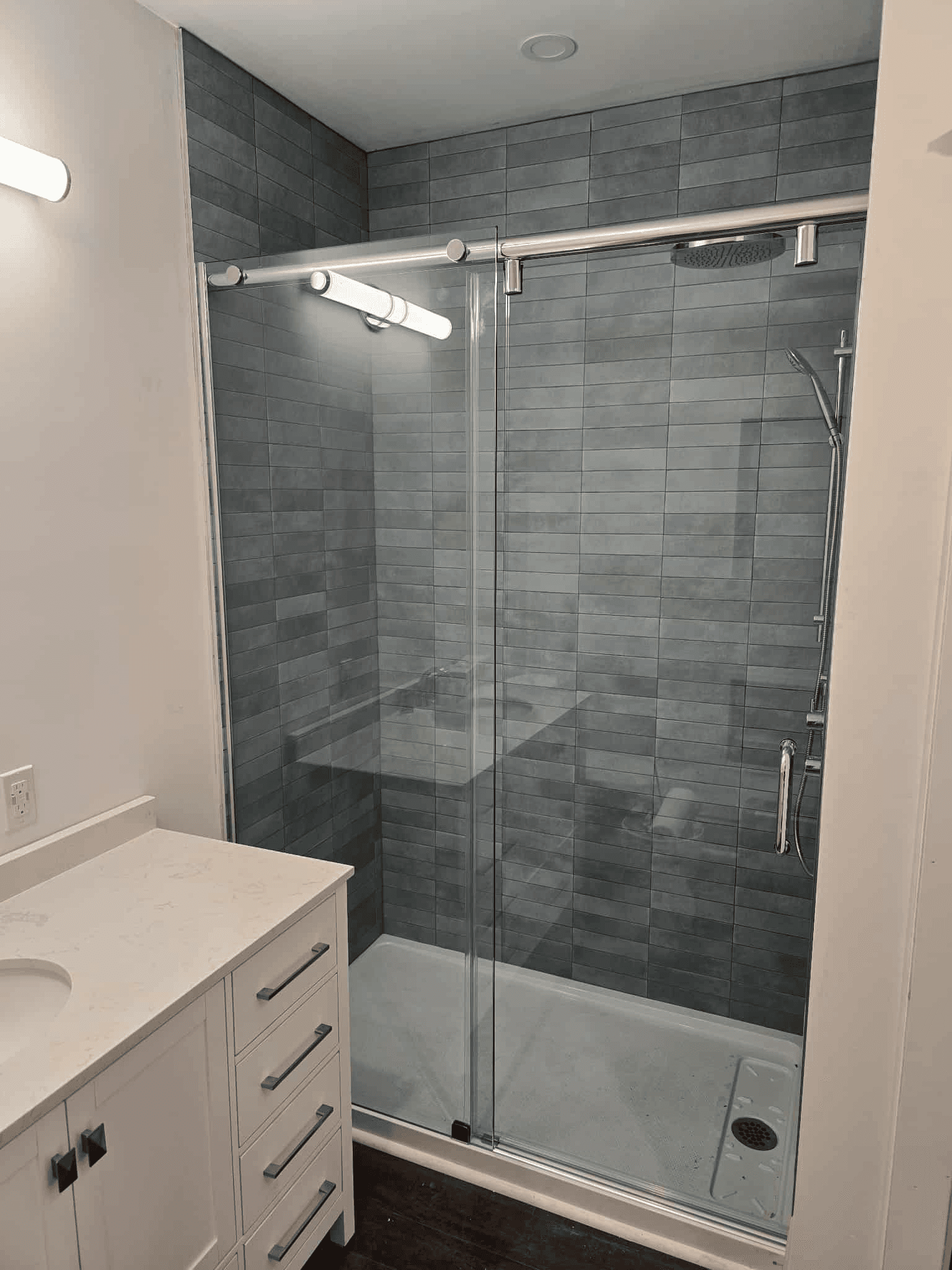 Dark grey shower with glass doors